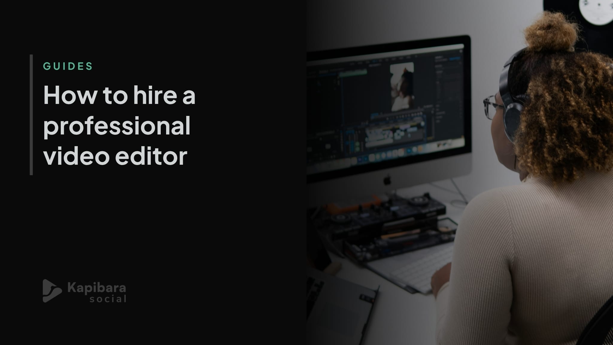 A video editor working at a desktop workstation with editing software open